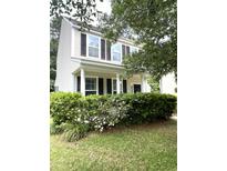 Charming two-story home with black shutters and a well-manicured lawn at 4816 Cane Pole Ln, Summerville, SC 29485