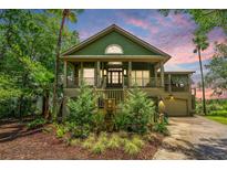 Charming two-story home with a landscaped front yard and inviting front porch at 1520 Regimental Ln, Johns Island, SC 29455