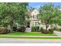 Charming two-story home with well-maintained landscaping and a welcoming front porch at 1664 William Hapton Way, Mount Pleasant, SC 29466