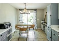 Cozy eat-in kitchen dining area with natural light and stylish chandelier at 104 Queens Ct, Summerville, SC 29485
