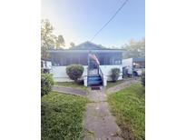 Charming single story home with screened in porch and lush green front lawn at 1124 Davidson Ave, Charleston, SC 29407