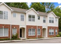 Inviting townhome showcases a classic brick facade and neutral siding at 241 Howle Ave # G, Charleston, SC 29412