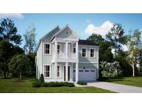 Charming two-story home featuring a porch, balcony, attached garage, and landscaped front yard at 216 Callibluff Dr, Summerville, SC 29486