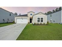 Charming single-Gathering home with a well-manicured lawn and a two-car garage at 269 Firewheel Ct, Summerville, SC 29486