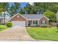 Charming brick home with a well-manicured lawn and an attached two-car garage at 3312 Telford Ct, Summerville, SC 29485