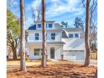 Charming new construction with a two-car garage and welcoming covered entryway at 518 Fleming Rd, Charleston, SC 29412