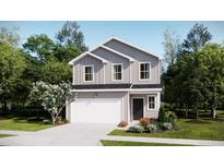 Charming two-story home featuring a white garage door, and beautifully landscaped front yard at 620 Culpepper St, Summerville, SC 29486