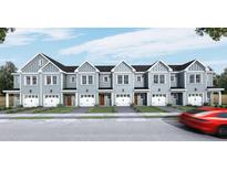 Charming row of light blue townhouses featuring individual garages and welcoming front lawns at 123 Kirkland St, Goose Creek, SC 29445