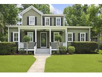 Charming two-story home with a welcoming front porch and well-manicured lawn, enhancing its curb appeal at 2258 Arthur Gaillard Ln, Charleston, SC 29414