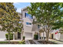 Charming townhome with a well-maintained lawn, inviting entrance, and attached one car garage at 4060 Hartland St, Charleston, SC 29414