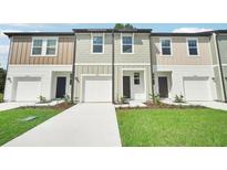 New townhomes feature a classic design with attached garages and professionally landscaped yards at 493 Colchester Court Ct, Moncks Corner, SC 29461