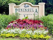 Beautifully landscaped entrance sign for the Peninsula luxury condominium resort at 700 Daniel Ellis Dr # 5103, James Island, SC 29412
