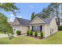 Charming single-Gathering home with manicured lawn, attached garage, and lovely curb appeal at 9016 Greenbriar Dr, Summerville, SC 29485