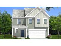 Charming two-story home with a welcoming front porch and a two-car garage nestled on a well-manicured lawn at 111 Cadbury Loop, Summerville, SC 29486