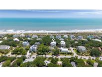 Beautiful oceanfront home nestled amongst lush greenery with direct beach access at 14 55Th Ave, Isle of Palms, SC 29451