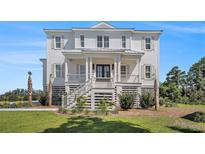Charming two-story home featuring a welcoming front porch and classic architectural details at 1491 Tomato Farm Cir, Mount Pleasant, SC 29464