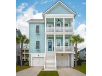 Charming two-story coastal home with light blue siding, white trim, and double front porches at 2313 Bucktail Ct, Mount Pleasant, SC 29466