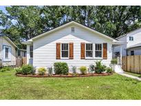 Charming cottage-style home with beautiful landscaping and inviting curb appeal. Freshly painted, updated windows and shutters at 2949 Alabama Dr, North Charleston, SC 29405
