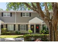 Charming townhome featuring a mix of siding and brick facade, complemented by black shutters and a welcoming front entrance at 507 Stinson Dr # E8, Charleston, SC 29407