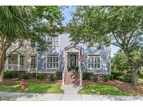 Charming two-story home featuring a welcoming entrance and well-maintained landscaping at 1100 Griswold St, Mount Pleasant, SC 29466