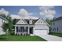 Charming home with gray siding, black shutters, and a two-car garage, complemented by a lush green lawn at 149 Seaton St, Summerville, SC 29486