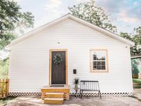 Charming home with white siding, a cozy front porch, and a decorative wreath on the front door at 2157 Jeff St, North Charleston, SC 29405