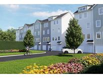 Well-maintained townhome community with gray siding, manicured lawns, and mature landscaping at 2161 W Jimtown Dr # 101, North Charleston, SC 29405