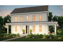Charming two-story home features a welcoming front porch, complemented by professionally landscaped front yard at 250 Clearpath Dr, Summerville, SC 29486