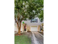 Inviting townhouse exterior with well-maintained siding, attached garage, and manicured lawn, offering great curb appeal at 4030 Babbitt St, Charleston, SC 29414