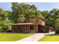 Charming two-story home with a covered porch and well-maintained lawn at 5904 Hagood Ave, Hanahan, SC 29410