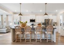 Modern kitchen featuring an island with seating and stainless steel appliances at 147 Seaton St, Summerville, SC 29486