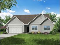 Charming single-story home with a two-car garage, gray siding, and a beautifully landscaped front yard at 263 Huguenot Trl, Huger, SC 29450