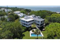 Stunning coastal home with a private pool and lush landscaping, offering an idyllic retreat near the ocean at 932 Middle St, Sullivans Island, SC 29482