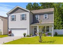 Charming two-story home featuring gray and white siding, a well-maintained lawn, and an attached two-car garage at 108 Rusting Link Rd, Summerville, SC 29483