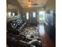 Inviting living room with leather furniture and a ceiling fan at 207 Congaree River Dr, Summerville, SC 29485