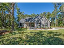 Charming single-Gathering home with beautiful landscaping and a well-maintained lawn at 0 Peirce Rd, Ridgeville, SC 29472