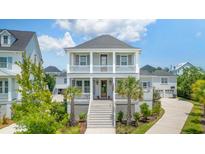 Charming two-story home with a welcoming front porch and manicured landscaping at 1722 Trewin Ct, Charleston, SC 29492