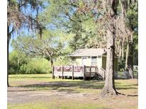 Exterior of a cute cottage with a deck at 4589 Prices Bridge Ln, Walterboro, SC 29488