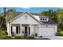 Charming home with a two-car garage, a covered porch, and beautiful landscaping at 1027 Riverbed Retreat Ln, Summerville, SC 29483