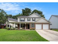 Charming two-story home with a covered front porch and a two-car garage at 133 Guildford Dr, Goose Creek, SC 29445