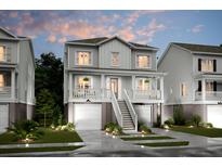 Charming two-story home with a welcoming front porch, a finished garage and manicured landscaping at 1751 Cultivation Lane Dr # 498, Mount Pleasant, SC 29466