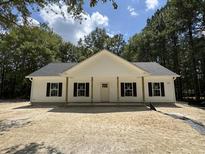 Charming single-story home with a covered front porch and a classic white exterior at 216 Hill Dr, Summerville, SC 29483