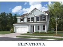 Charming two-story home with a manicured lawn, attached garage, and classic curb appeal at 353 Wappoo Trace Ln, Summerville, SC 29486