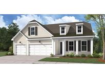 Charming two-story home with a three car garage, dormer windows, and landscaped front yard at 731 Maynard Ln, Summerville, SC 29486