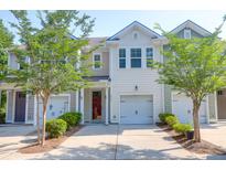 Charming townhome with neutral siding, single-car garage, and well-manicured landscaping at 4964 Hay Bale Ct, Summerville, SC 29485
