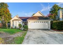 Charming single-story home featuring a well-manicured lawn and attached two-car garage at 419 Equinox Cir, Ladson, SC 29456