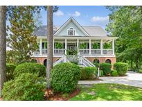 Charming two-story home featuring a welcoming front porch and beautiful landscaped yard at 5394 Clairmont Ln, North Charleston, SC 29420