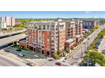 Stunning exterior of a multi-story brick condo building in an urban setting, perfect for city living at 150 Bee St # 308, Charleston, SC 29401