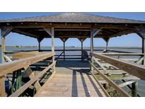 Picturesque gazebo on the water offering a serene spot to relax and enjoy waterfront views at 1551 Ben Sawyer Blvd # 4D, Mount Pleasant, SC 29464