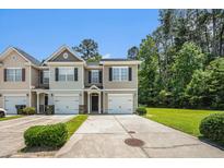 Charming townhome showcasing a well-manicured lawn, a one-car garage, and lovely curb appeal at 234 S Lamplighter Ln, Summerville, SC 29486